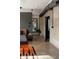 Modern main bedroom with a bed, exposed ductwork, and a doorway leading to the en suite bathroom at 4032 N 45Th Pl, Phoenix, AZ 85018