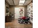 Contemporary office space with brick accent wall, custom bookshelves and modern furniture at 4032 N 45Th Pl, Phoenix, AZ 85018