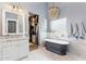 Spa-like bathroom featuring a soaking tub, walk-in closet, and luxurious finishes at 4132 N 42Nd St, Phoenix, AZ 85018