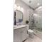 Updated bathroom featuring a marble walk-in shower with glass door and elegant vanity at 4132 N 42Nd St, Phoenix, AZ 85018