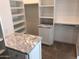 Walk-in closet with built-in shelving provides ample storage space and organization at 4132 N 42Nd St, Phoenix, AZ 85018
