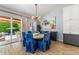 Elegant dining area with wood floors, stylish lighting, and views of the outdoor living space at 4132 N 42Nd St, Phoenix, AZ 85018