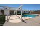 Backyard featuring a covered patio, pool with spa and gravel landscaping at 4234 E Winnetka Dr, Phoenix, AZ 85044