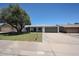 Charming single-story home with mature shade tree, well-kept lawn and neutral color palette at 4234 E Winnetka Dr, Phoenix, AZ 85044