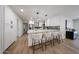 Modern kitchen featuring white cabinets, a large island, and stylish pendant lighting at 4234 E Winnetka Dr, Phoenix, AZ 85044
