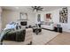 The cozy living room boasts a painted brick fireplace, contemporary furniture, and ample natural light at 4234 E Winnetka Dr, Phoenix, AZ 85044