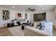 Inviting living room with plush seating, stylish decor, and a feature wall in a neutral tone at 4234 E Winnetka Dr, Phoenix, AZ 85044