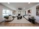This open-plan living room features comfortable seating, neutral décor, and wood-look flooring at 4234 E Winnetka Dr, Phoenix, AZ 85044