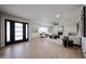 Bright living room features modern furnishings, white brick fireplace, and wood-look flooring at 4234 E Winnetka Dr, Phoenix, AZ 85044