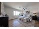 Comfortable primary bedroom featuring a ceiling fan, soft rug and bright, large windows at 4234 E Winnetka Dr, Phoenix, AZ 85044