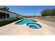 Inviting pool and spa surrounded by a spacious patio, creating a perfect backyard retreat at 4234 E Winnetka Dr, Phoenix, AZ 85044