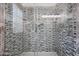 The mosaic tile details add style to this glass shower, creating a spa-like escape at 4234 E Winnetka Dr, Phoenix, AZ 85044