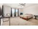 Bedroom with carpet, ceiling fan, window, and simple wooden bed frame at 44157 W Palo Amarillo Rd, Maricopa, AZ 85138