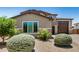 Side view of a two-story home with desert landscaping at 44157 W Palo Amarillo Rd, Maricopa, AZ 85138