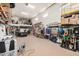 Organized garage features a high ceiling, ample storage solutions, and plenty of workspace at 44157 W Palo Amarillo Rd, Maricopa, AZ 85138