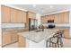 Kitchen featuring stainless steel appliances, granite countertops, and wooden cabinets at 44157 W Palo Amarillo Rd, Maricopa, AZ 85138