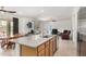 Open kitchen with island, granite countertops and stainless-steel appliances at 44157 W Palo Amarillo Rd, Maricopa, AZ 85138