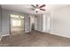 Carpeted bedroom offering a large mirrored closet and ensuite bathroom at 4434 E Bannock St, Phoenix, AZ 85044