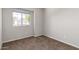 Cozy bedroom with neutral walls, carpet flooring and a window bringing in natural light and neighborhood views at 4434 E Bannock St, Phoenix, AZ 85044