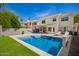 Backyard view showcasing a refreshing pool, outdoor kitchen, and lounging area perfect for entertainment at 4434 E Bannock St, Phoenix, AZ 85044