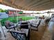 Covered patio with comfortable seating, perfect for outdoor relaxation, and featuring a fire pit at 4644 W Berridge Ln, Glendale, AZ 85301