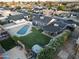 Spacious backyard featuring a private pool, lush green lawn, and mature landscaping, perfect for outdoor entertaining at 4644 W Berridge Ln, Glendale, AZ 85301