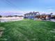 Expansive backyard featuring a lush lawn, refreshing pool, and a covered patio perfect for entertaining at 4644 W Berridge Ln, Glendale, AZ 85301