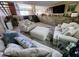 Cozy basement living room featuring plush seating, brick accents, and a relaxing atmosphere at 4644 W Berridge Ln, Glendale, AZ 85301