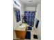 Bright bathroom with granite countertops, modern fixtures, and a tiled shower at 4644 W Berridge Ln, Glendale, AZ 85301