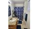 Bright bathroom with granite countertops, modern fixtures, and a tiled shower at 4644 W Berridge Ln, Glendale, AZ 85301