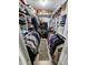 A walk-in closet with organized clothing racks, shelving, and ample storage space at 4644 W Berridge Ln, Glendale, AZ 85301