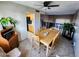 The dining room has tile floors, a light wood table with seating for six, and a view of the kitchen at 4644 W Berridge Ln, Glendale, AZ 85301