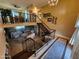 Bright, high-ceiling entryway with decorative railings, tile floors, and stairs leading to the second level, with living room view at 4644 W Berridge Ln, Glendale, AZ 85301