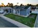 Attractive single-Gathering property boasting a lush green lawn and a cozy front porch in a serene location at 4644 W Berridge Ln, Glendale, AZ 85301