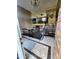Foyer featuring staircase with metal railing and brick accent wall at 4644 W Berridge Ln, Glendale, AZ 85301
