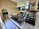 Foyer featuring staircase with metal railing and brick accent wall at 4644 W Berridge Ln, Glendale, AZ 85301