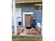 Charming home entrance with a detailed wooden door, iron security door, and colorful tiled porch at 4644 W Berridge Ln, Glendale, AZ 85301