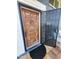 A beautiful carved wooden front door with a decorative security screen at 4644 W Berridge Ln, Glendale, AZ 85301
