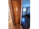 Hallway view showing a built-in closet and access to the adjacent bedroom at 4644 W Berridge Ln, Glendale, AZ 85301