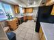 Sunlit kitchen with updated appliances, countertops, and ample cabinet space at 4644 W Berridge Ln, Glendale, AZ 85301
