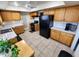 Well-lit kitchen featuring spacious countertops, wood cabinets, and a modern gas range at 4644 W Berridge Ln, Glendale, AZ 85301