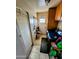 Convenient laundry room with washer, dryer hookups, storage cabinets, and access to the exterior at 4644 W Berridge Ln, Glendale, AZ 85301