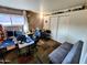 Office with brick accent wall, and bright natural light at 4644 W Berridge Ln, Glendale, AZ 85301