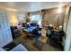A well lit home office with concrete walls, multiple monitors, and tile carpeting at 4644 W Berridge Ln, Glendale, AZ 85301