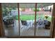 Covered outdoor patio showcasing comfortable seating and a view of the well-maintained, fenced backyard at 4644 W Berridge Ln, Glendale, AZ 85301