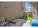 A charming backyard featuring a paver patio, artificial turf, and space for outdoor relaxation and entertainment at 5741 W Warner St, Phoenix, AZ 85043