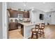 Open kitchen featuring a large island with granite countertops and stainless-steel appliances at 5741 W Warner St, Phoenix, AZ 85043