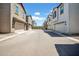 A serene neighborhood street scene showcasing well-maintained homes with garages and tidy landscaping at 5741 W Warner St, Phoenix, AZ 85043