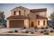 Charming two-story home featuring a tile roof, a two-car garage, and desert landscaping, perfect for Southwestern living at 6354 W Rushmore Way, Florence, AZ 85132