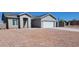 Charming single-story home with a two-car garage and low-maintenance gravel landscaping at 8588 E Edgewood Ave, Mesa, AZ 85208